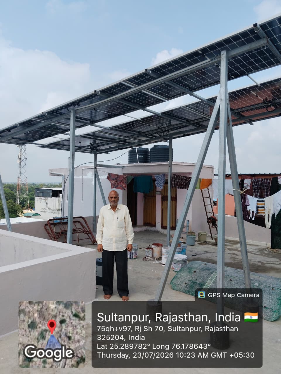 Large rooftop solar canopy over a terrace with the homeowner standing under it