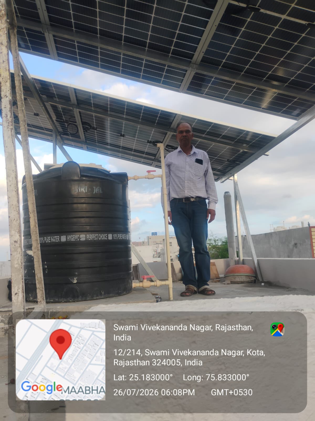 Rooftop solar canopy installed above a water tank, customer standing below